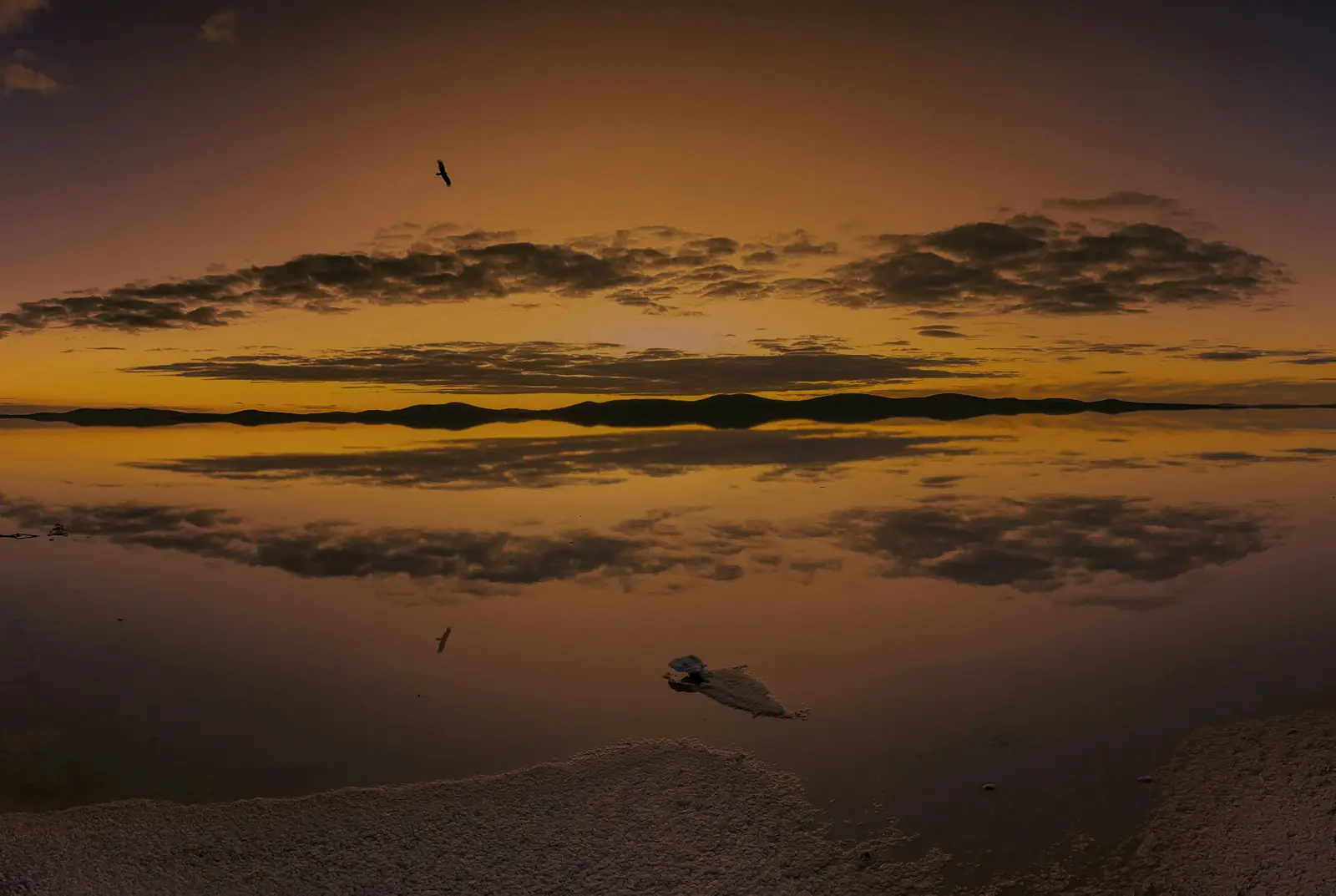 Lake Gairdner, a salt lake holding rainwater, reflecting a sunset sky